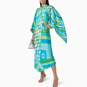 Detail of high collar and large flared sleeves on a geometric print maxi dress