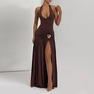 Detail of dark brown halter dress featuring side ruching and a gold floral metal buckle