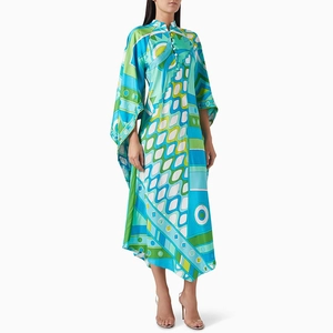 Detail of colorful geometric abstract pattern on smooth satin long-sleeve dress fabric