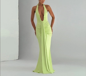 Detail of elegant lime green ruched waist and deep V-neckline on backless maxi dress