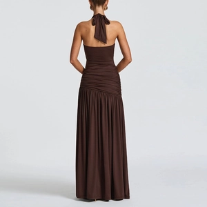 Detail of deep brown halter dress showing backless design and ruched fabric texture