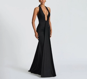Detail of elegant black halter neck gown with deep V-neck and ruched waistline draping