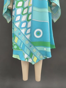 Detail of vintage geometric pop art patterns on lightweight woven dress fabric