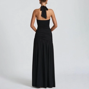 Detailed back view of a black halter neck maxi dress with ruched design and open back style
