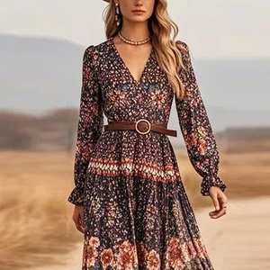 Close-up of bohemian floral print dress showing deep V-neck and tiered skirt detail