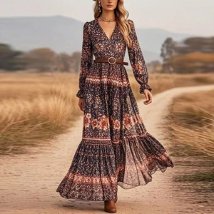 Detail of V-neck printed bohemian maxi dress with long sleeves and brown leather belt