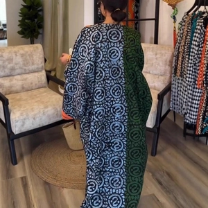 Rear view of a long-sleeved loose maxi kaftan dress with asymmetric patchwork patterns