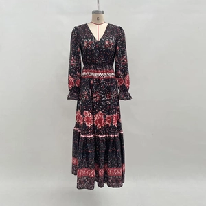 Bohemian floral V-neck maxi dress with long sleeves and tiered skirt in dark print