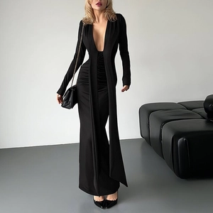 Detail view of a black deep V-neck long-sleeved slim dress with elegant waist pleats