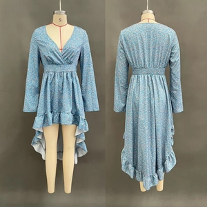 Detail view of blue floral long sleeve dress with V-neck and ruffled asymmetrical hemline