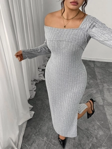 Detail showing the gray ribbed knit fabric and side slit of this elegant maxi dress