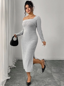 Detail of grey ribbed knit long sleeve dress with square neck and side slit design