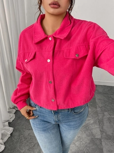 Detailed view of wide wale corduroy texture and silver buttons on pink jacket