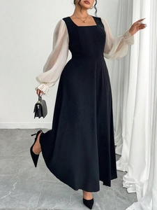 Détail de la robe noire élégante à encolure carrée et manches bouffantes en tulle