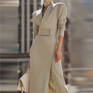 Elegant beige long-sleeve V-neck midi dress with waist belt and front slit detail