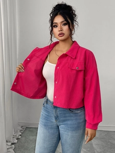 Detail of rose pink corduroy jacket featuring single-breasted buttons and chest pocket