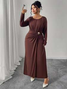 Detailed view of coffee brown maxi dress with side pleats and a gold ring buckle