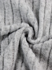 Detail of grey ribbed knit fabric with soft brushed texture and vertical striped pattern
