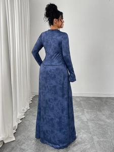 Detailed view of navy blue marble tie-dye texture on the long-sleeved A-line maxi dress