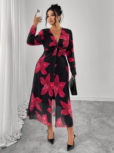 Detail of floral V-neck dress with front knot and slit showing fabric drape and print