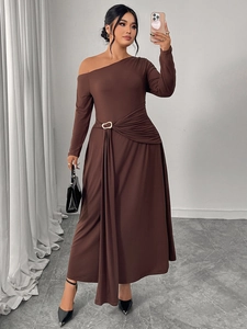 Detail of elegant chocolate brown one-shoulder dress with waist ruching and metal buckle