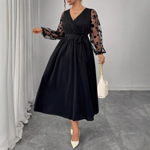 Elegant black V-neck maxi dress with sheer floral embroidery sleeves and waist tie