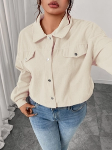 Detailed view of beige corduroy jacket with front metal buttons and chest flap pockets