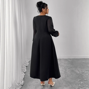 Elegant black long-sleeved midi dress with chiffon sleeves and flattering A-line silhouette