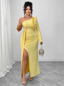 Close-up of the elegant one-shoulder ruffle design and side high slit on the yellow gown