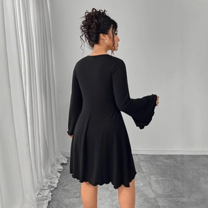 Elegant black long sleeve mini dress featuring flared sleeves and a slimming A-line silhouette