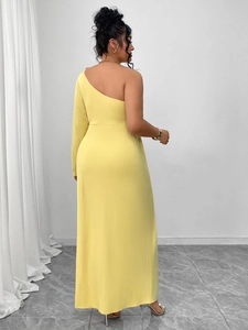 Detail of elegant one-shoulder yellow maxi dress with slim fit back view and high slit