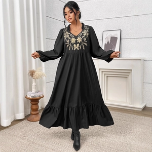 Plus size black V-neck maxi dress with gold floral embroidery and layered ruffle hem