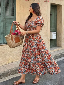 Detail of square neck and smocked bodice on a floral puff sleeve maxi dress