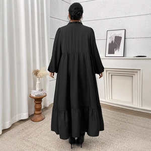 Elegant plus size black high waist tiered maxi dress with long puff sleeves and ruffle trim