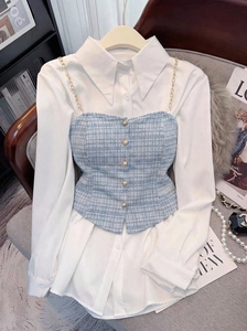 Detail of tweed vest with gold buttons and white shirt set styled with pearl necklace