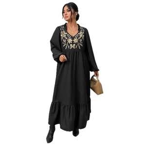 Plus size black V-neck maxi dress with gold floral embroidery and ruffled hem details