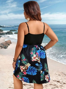 Detailed back view of a plus-size tropical print camisole dress at a sunny beach setting