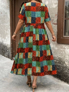 Detailed back view of a colorful ethnic boho midi dress with patchwork patterns