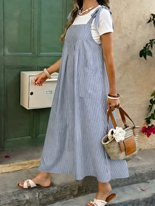 Detail of blue and white striped dress showing side pocket and ribbon shoulder straps