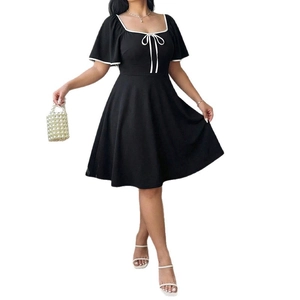 Elegant black A-line dress with square neckline and white bow accent for a slim fit look