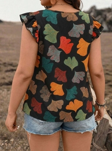 Detailed back view of a black flutter sleeve top featuring vibrant ginkgo leaf print