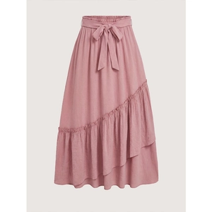 Pink tiered midi skirt with elastic high waist, ruffle details and a front bow tie accent