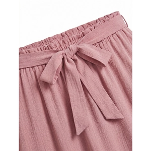 Pink plus size tiered skirt with elastic high waist and decorative bow tie detail
