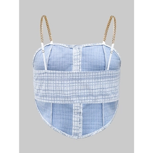 Blue tweed corset top with gold chain straps and white adjustable ties on grey background