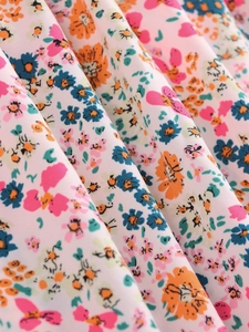Detailed close-up showing soft texture and vibrant floral pattern of the chiffon fabric