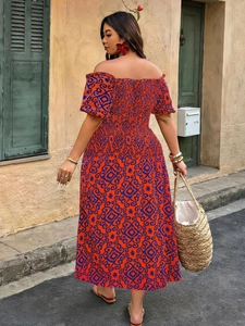Detail of off-shoulder maxi dress with red and blue geometric print and smocked bodice