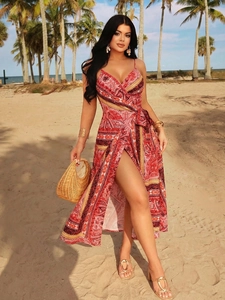 Detail of bohemian red paisley print maxi dress with deep V-neck and sexy high side slit
