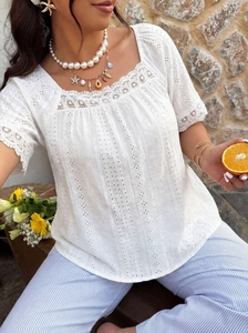 Detail of white square neck eyelet top with lace trim and charming pearl necklace