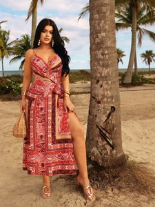 Detail of bohemian red paisley print dress featuring a sexy V-neck and high side slit