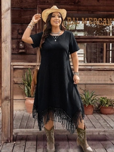 Black plus size boho dress with textured fabric and irregular fringe hem detail